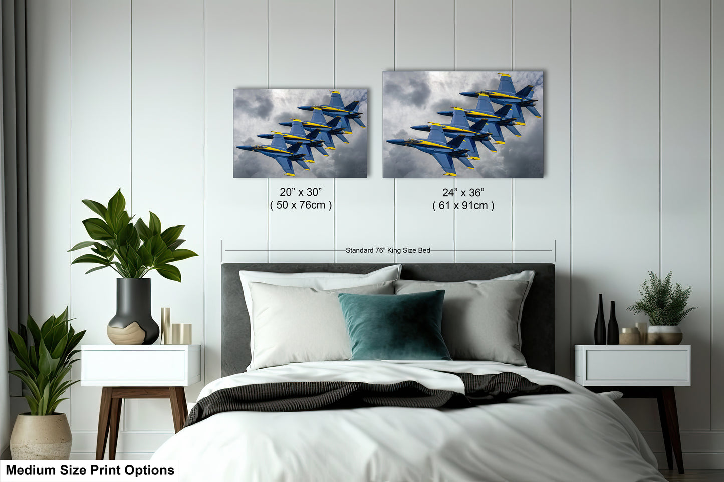 a bed room with a neatly made bed and two paintings on the wall