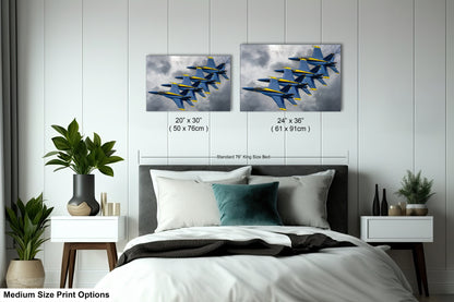 a bed room with a neatly made bed and two paintings on the wall