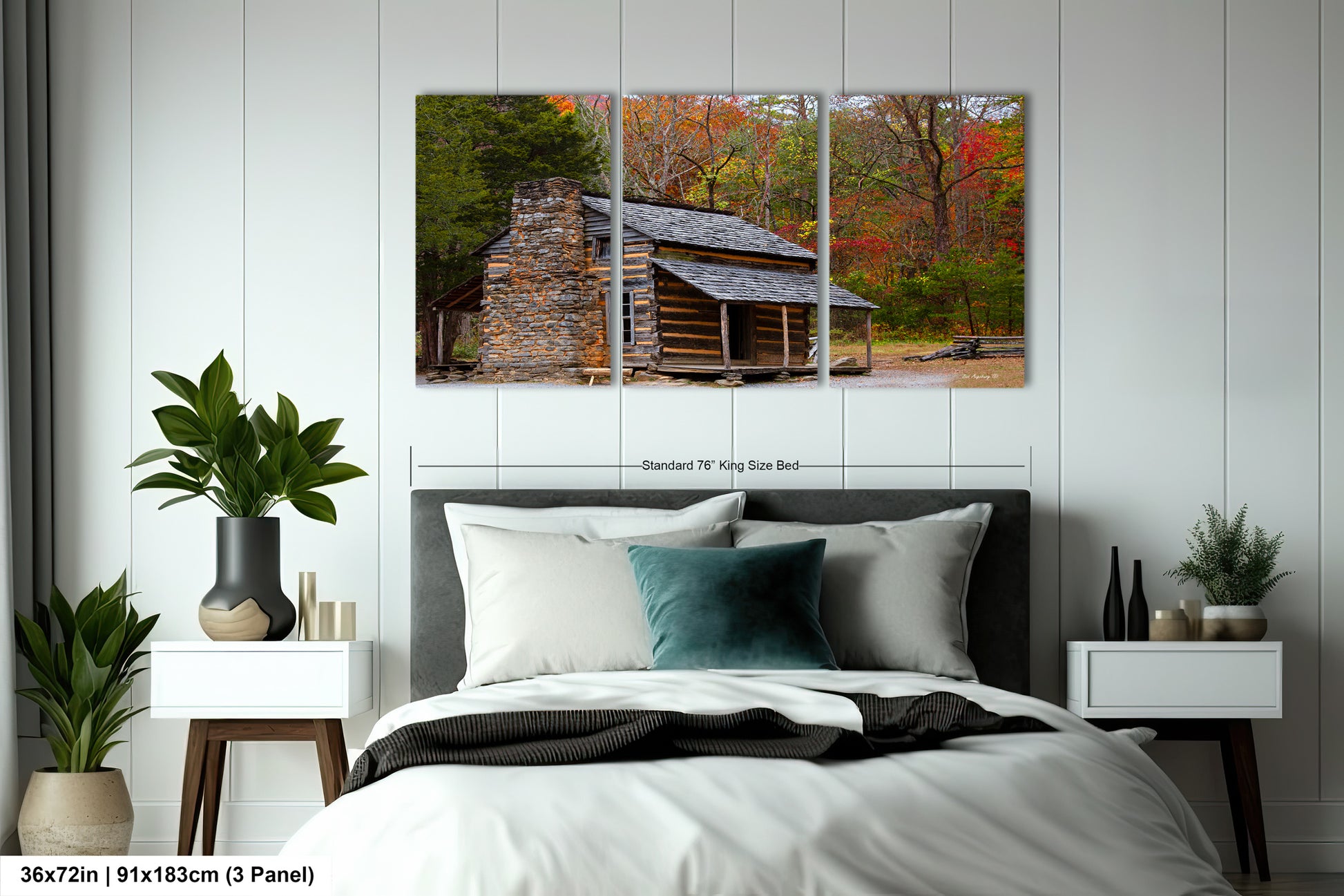 a bedroom with a bed and a picture of a log cabin
