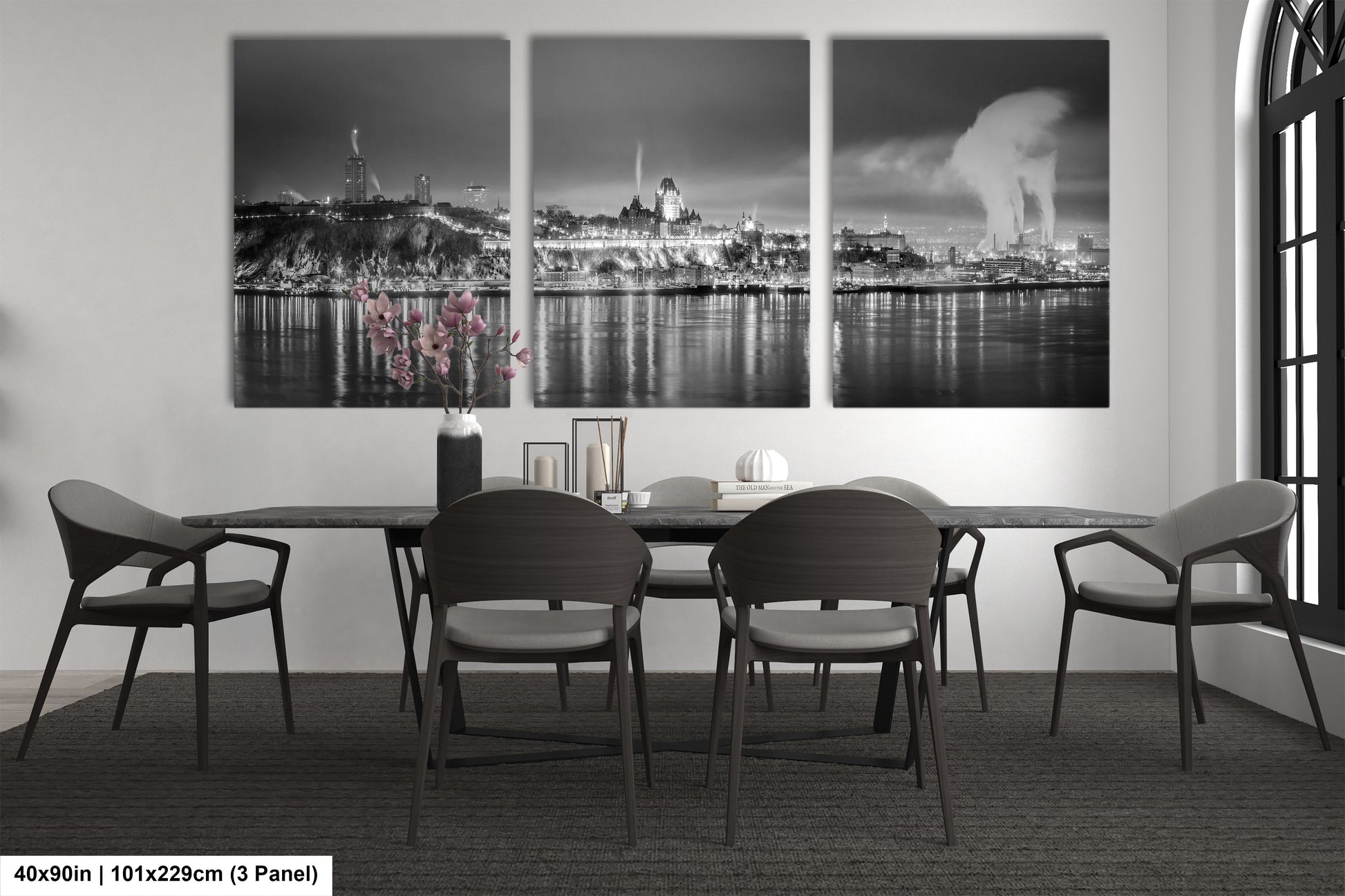a black and white photo of a dining room