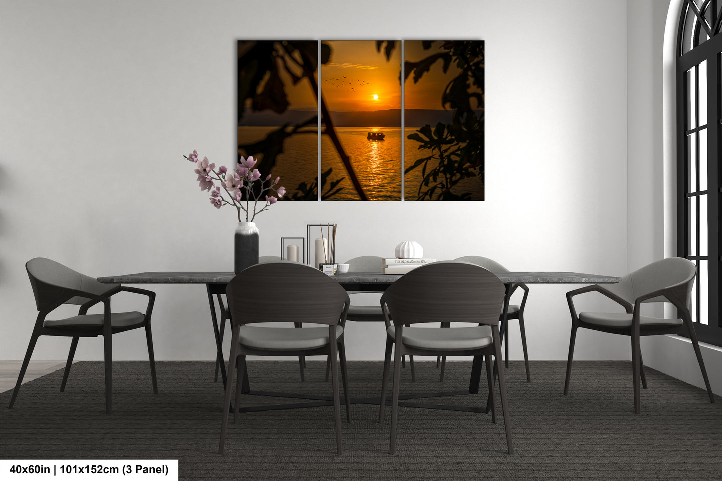 a dining room table with chairs and a vase of flowers