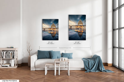 a living room with a white couch and two paintings on the wall