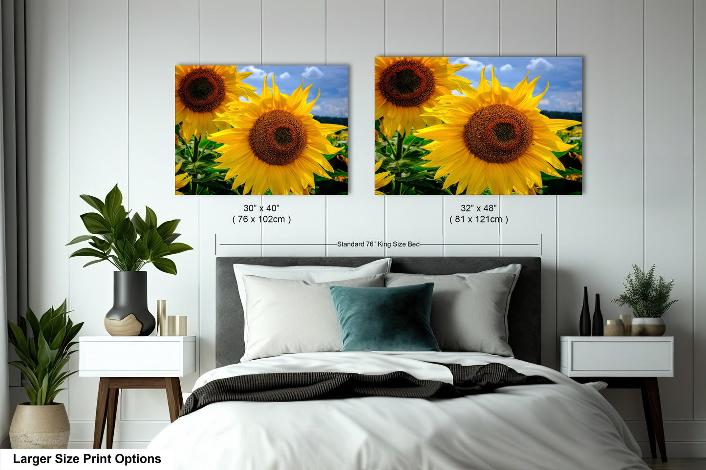 a bed with two pictures of sunflowers on the wall