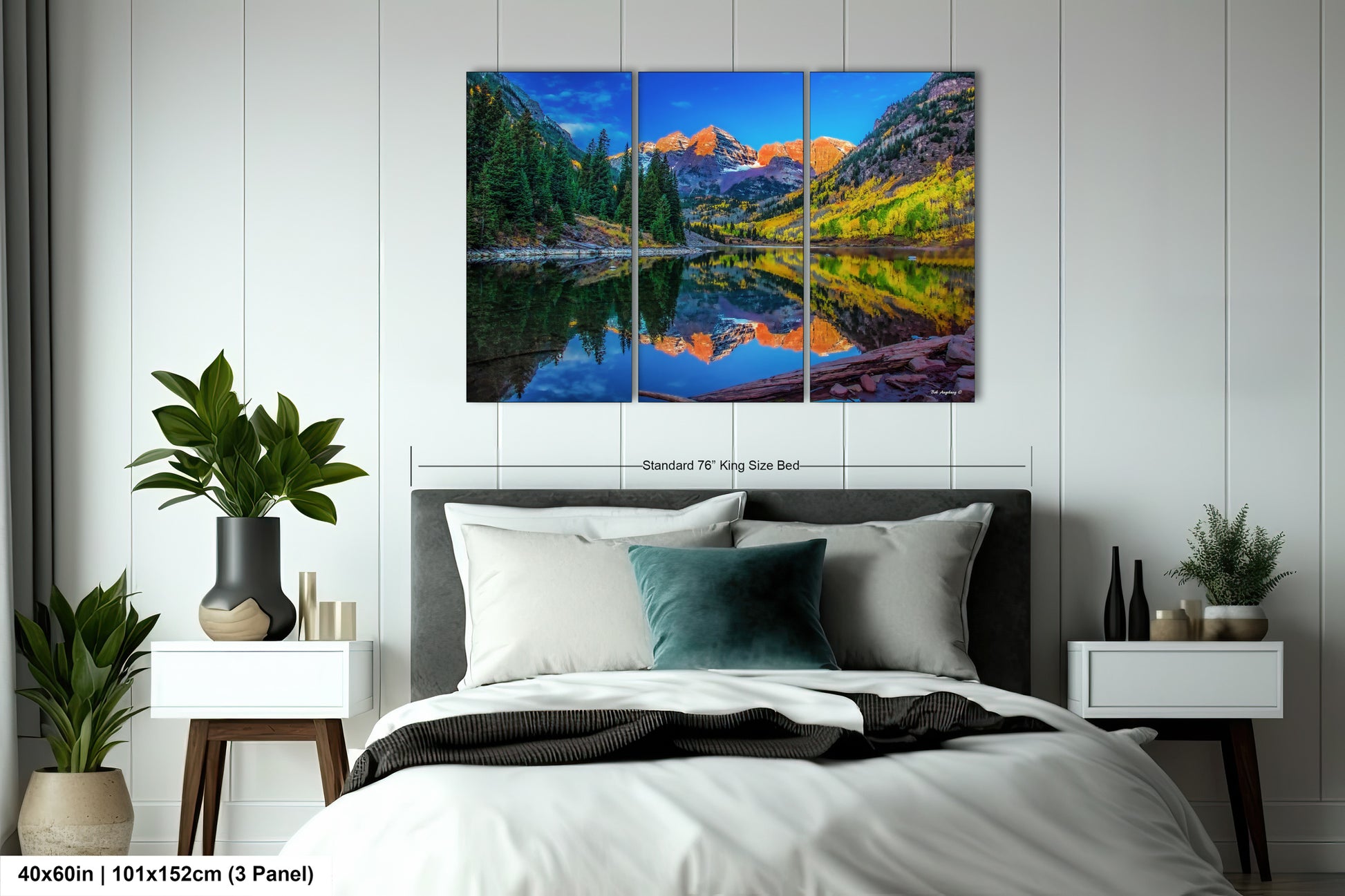 a bedroom with a bed and a painting on the wall
