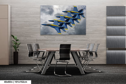 a group of fighter jets flying through a cloudy sky