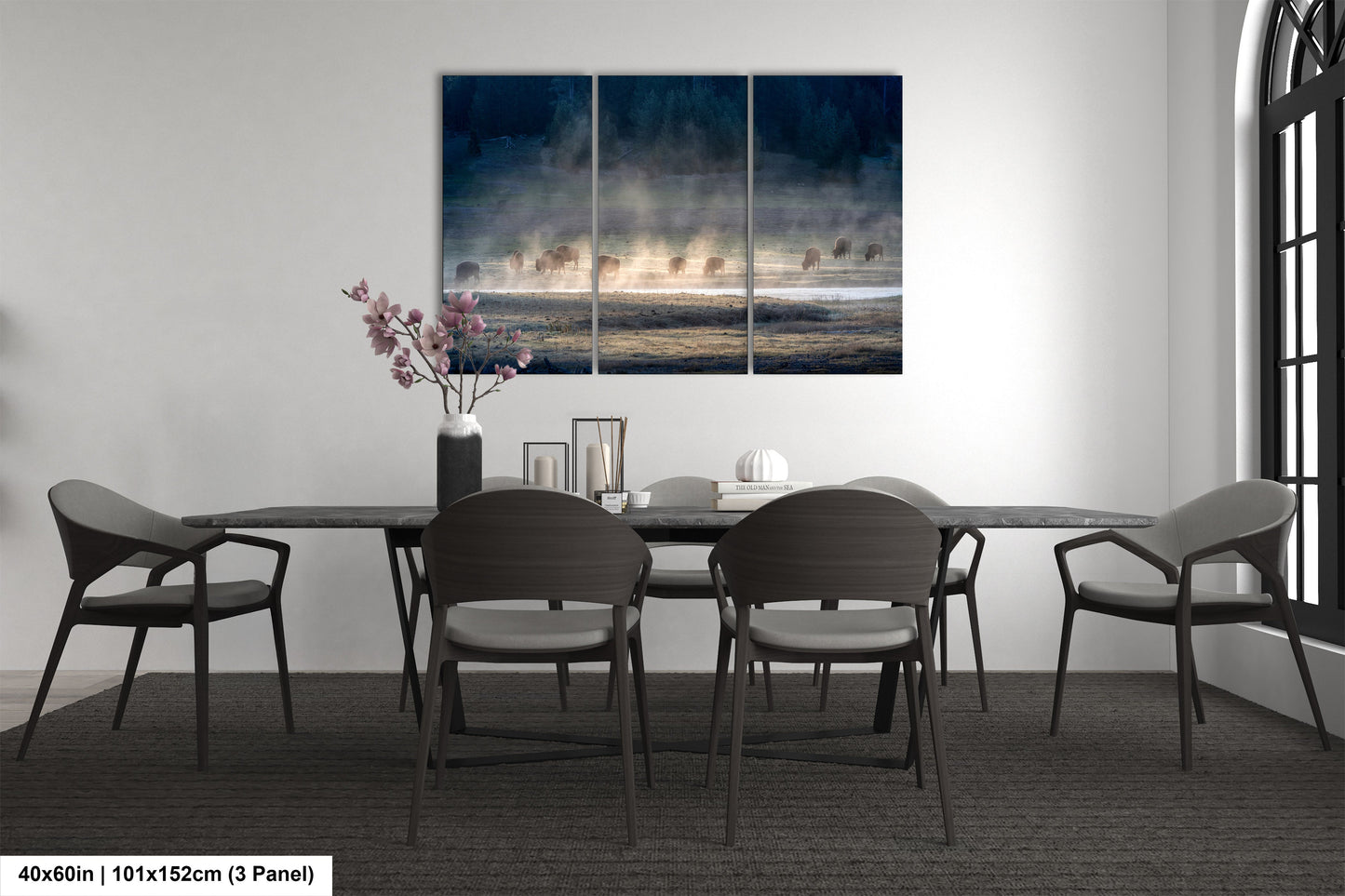 a dining room table with four chairs and a painting on the wall