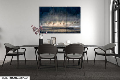 a dining room table with four chairs and a painting on the wall