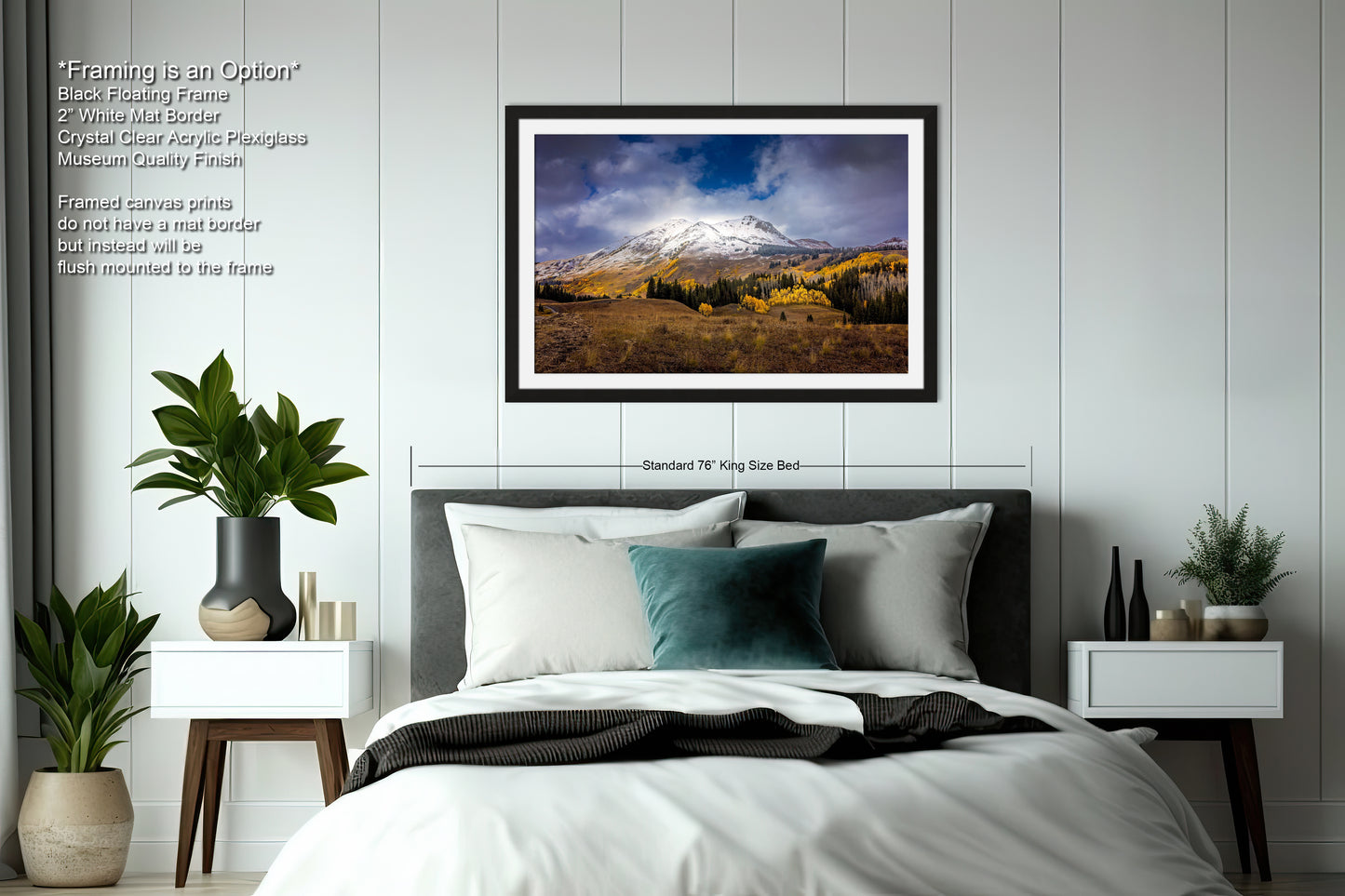 a bedroom with a bed and a picture hanging on the wall