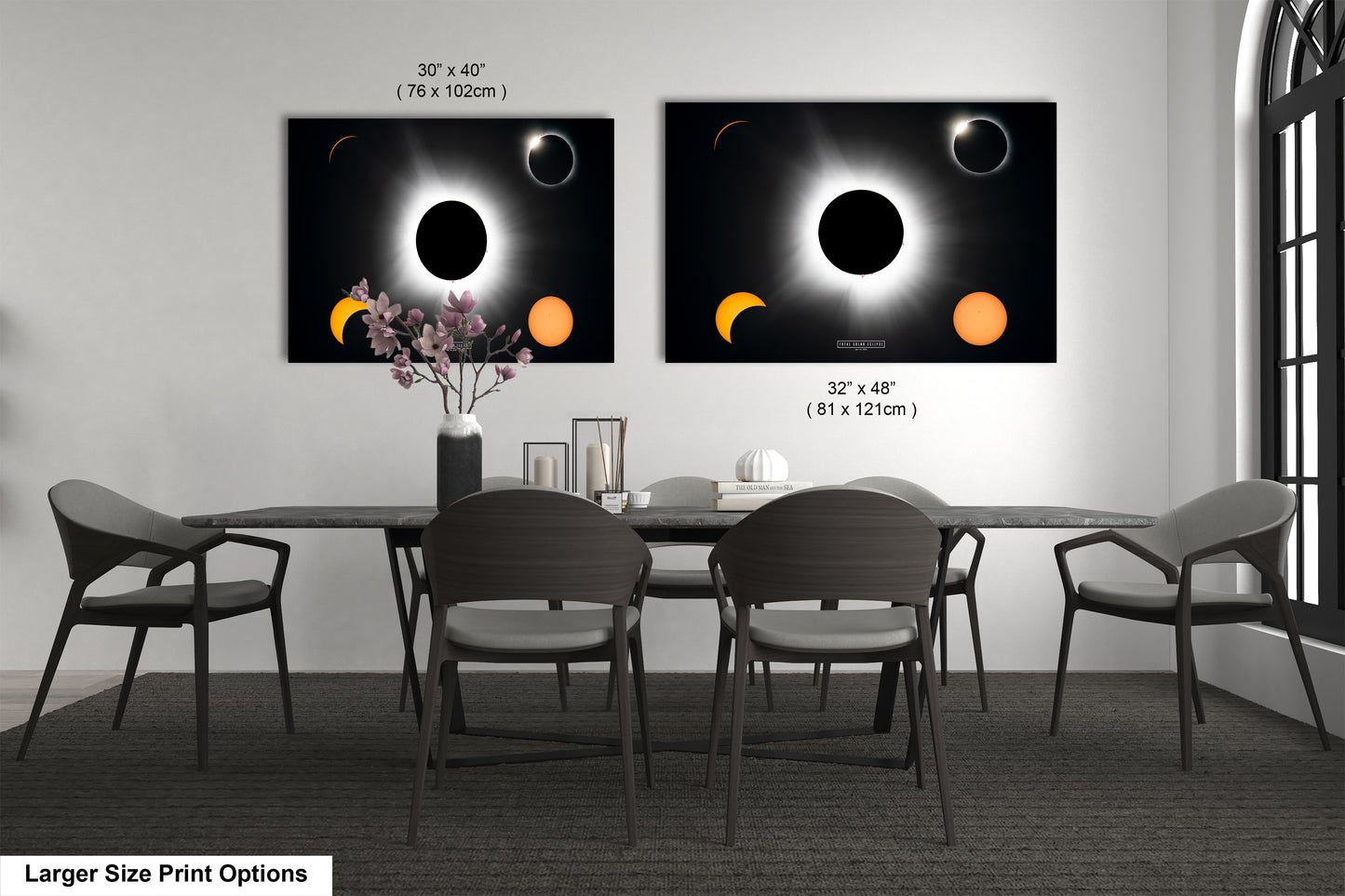 a dining room table with four chairs and a vase with flowers