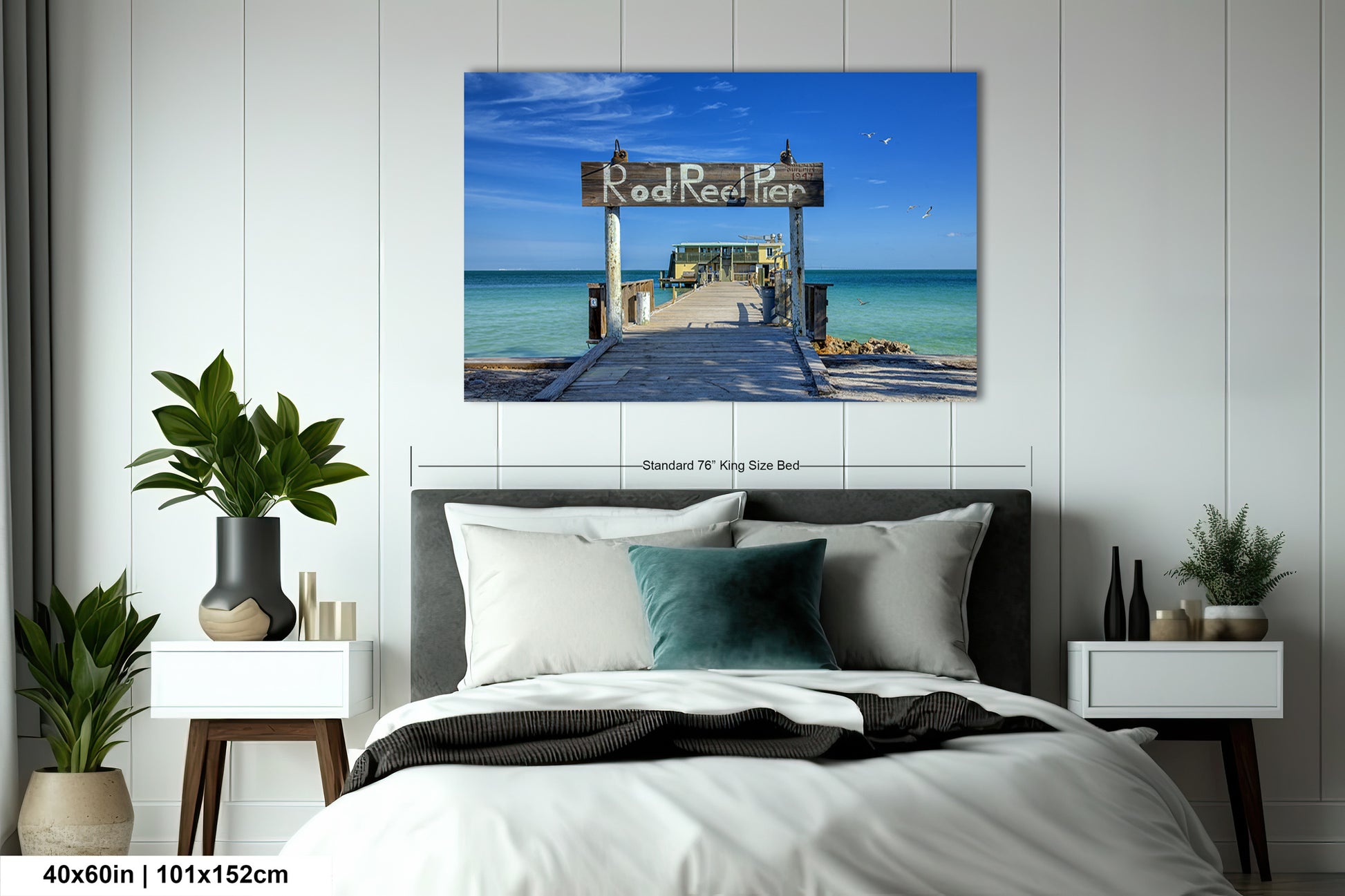 a bedroom with a bed and a painting on the wall
