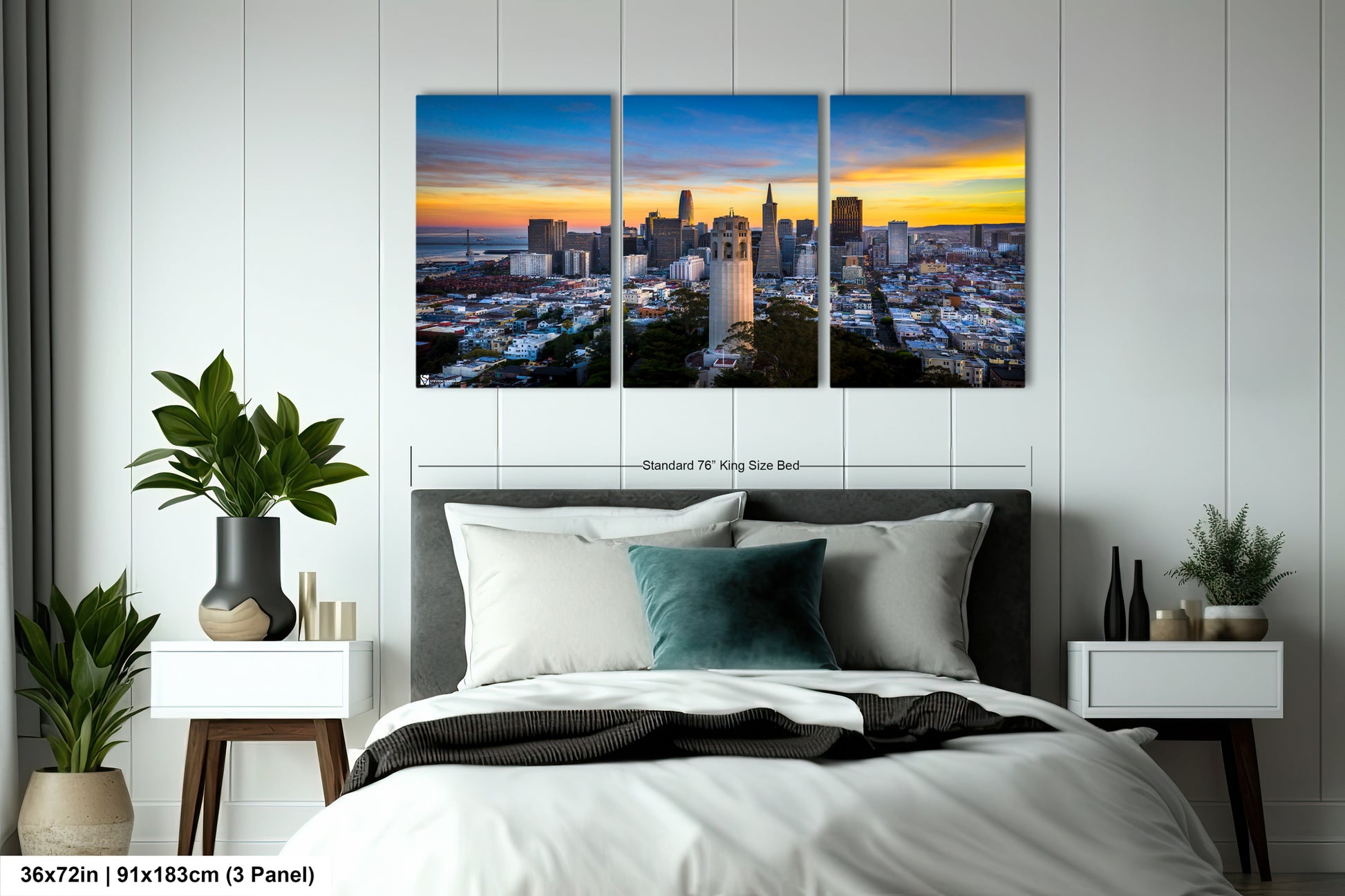 a bedroom with a bed and two paintings on the wall