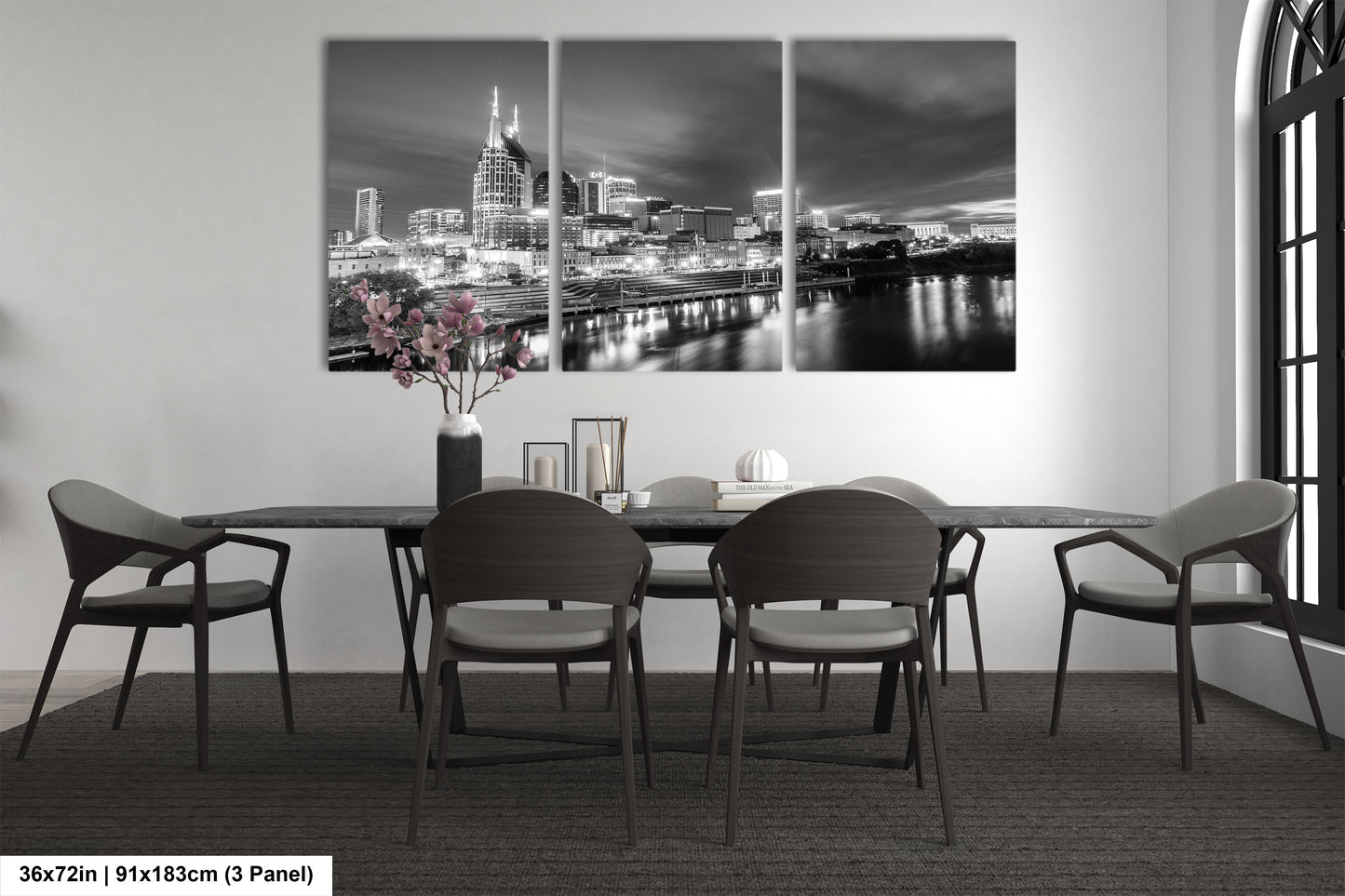 a black and white photo of a dining room table