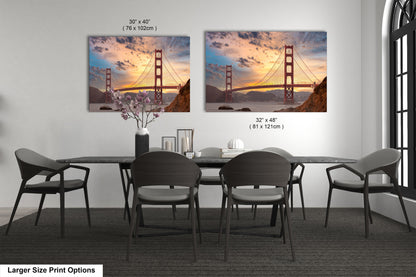 a dining room table with chairs and a picture of the golden gate bridge
