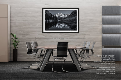 a black and white photo of a table and chairs