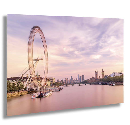 a ferris wheel on a river with a city in the background