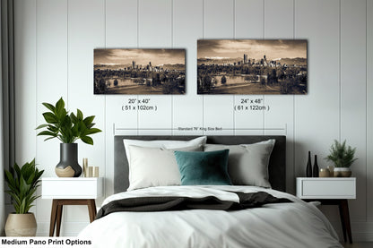 a bedroom with a bed and two pictures on the wall