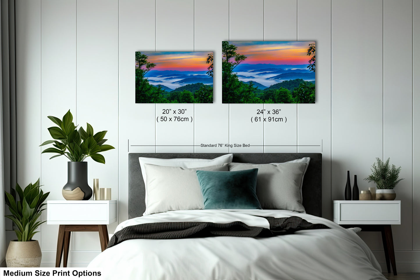 a bedroom with a bed and two paintings on the wall