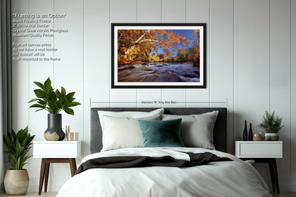 a bedroom with a bed and a picture hanging on the wall