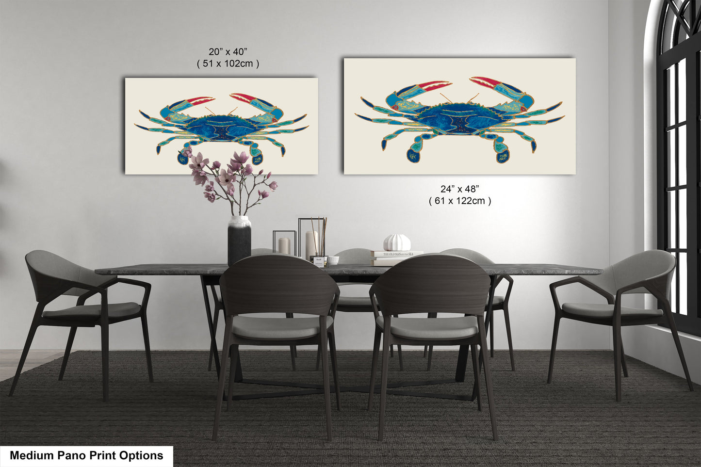 a dining room table with four chairs and two paintings on the wall
