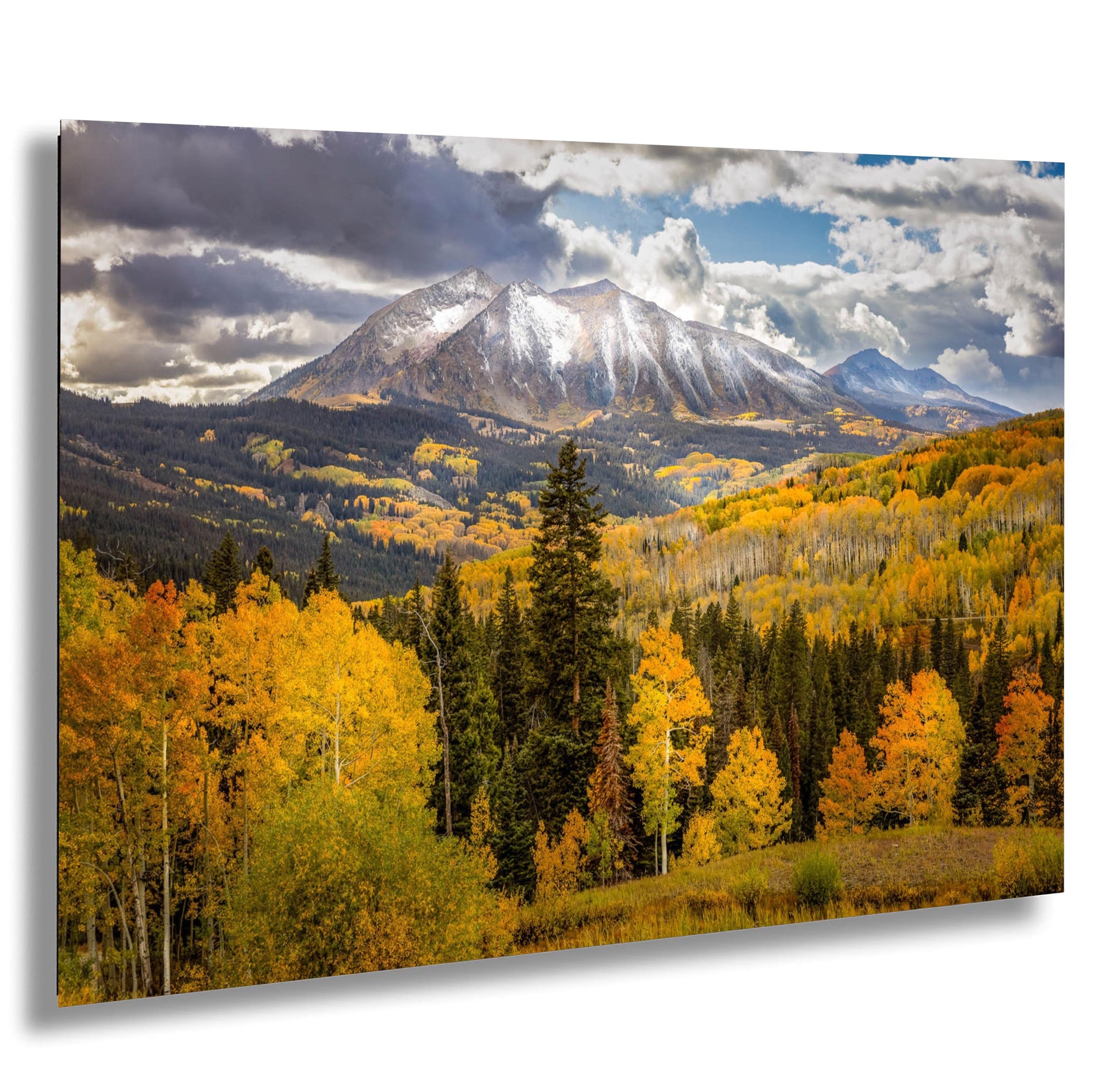 a view of a mountain range with trees in the foreground