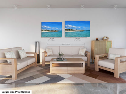 a living room with two pictures on the wall