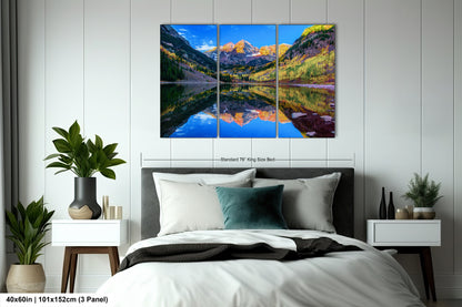 a bedroom with a bed and a painting on the wall
