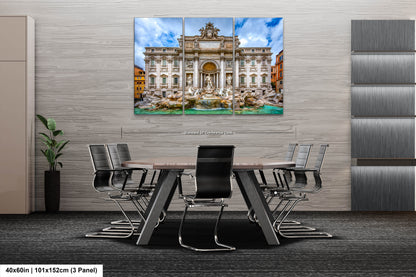 a dining room table with chairs and a painting on the wall