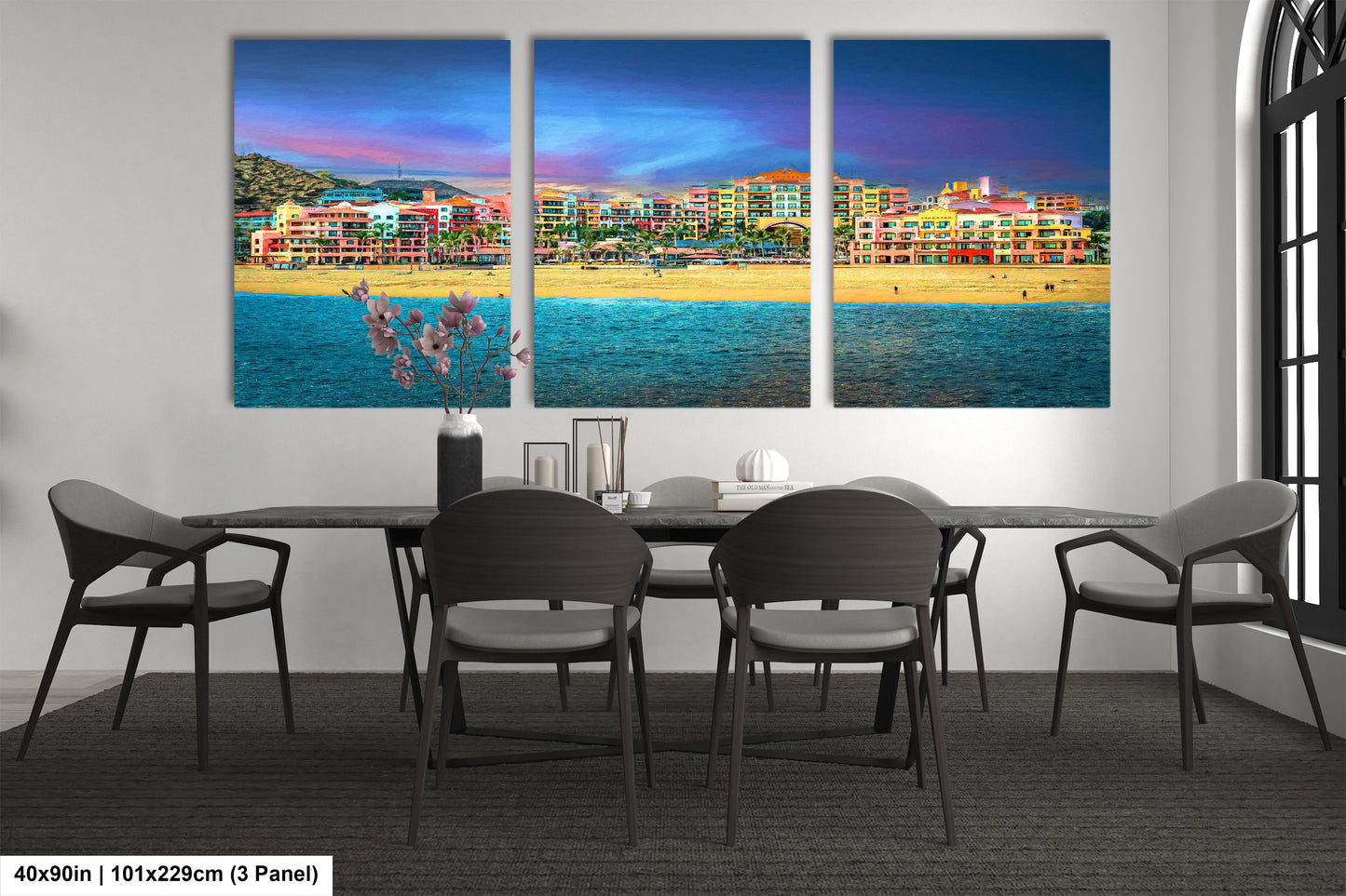 a dining room table with four chairs and a painting on the wall