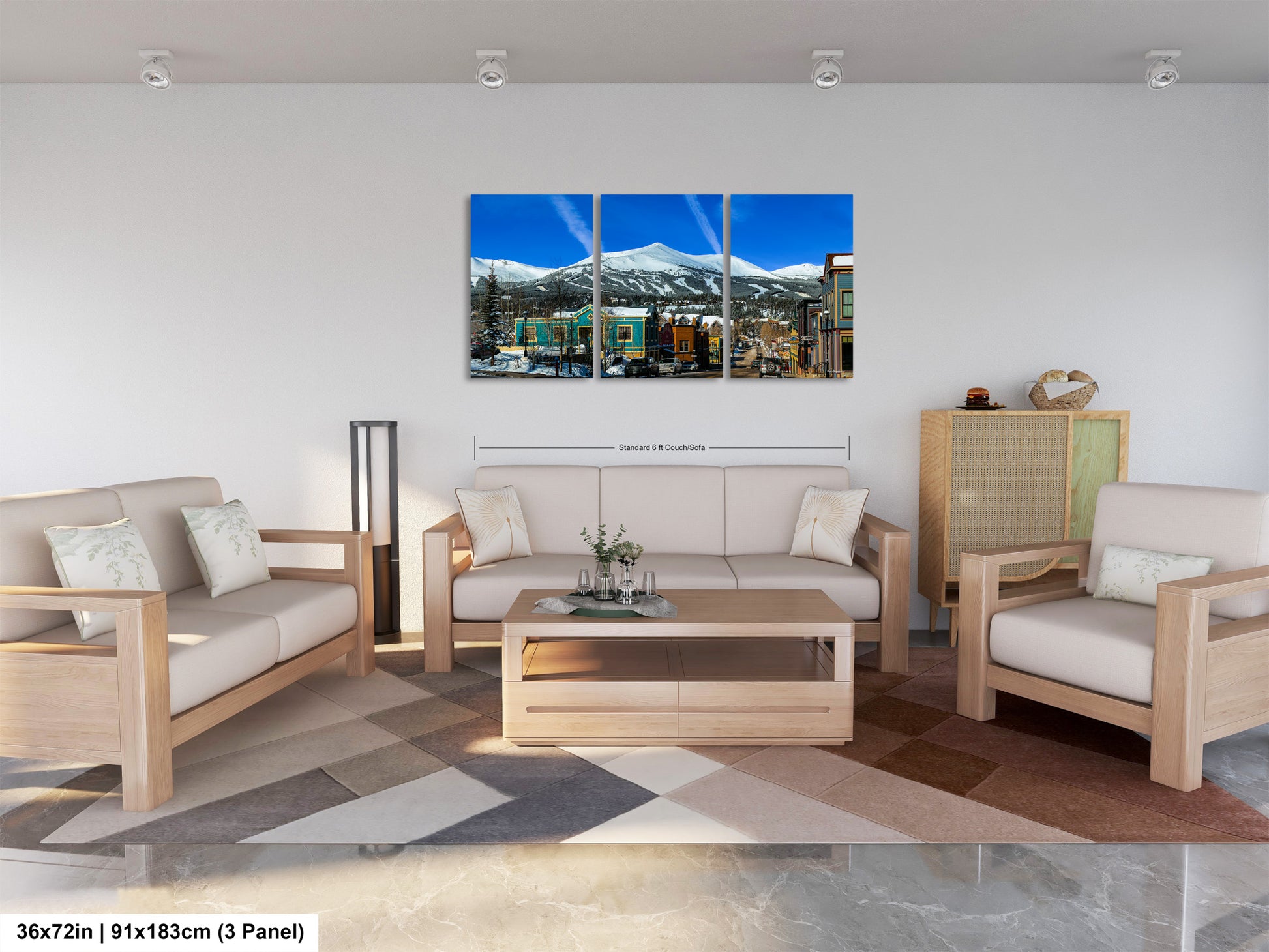 a living room filled with furniture and a painting on the wall