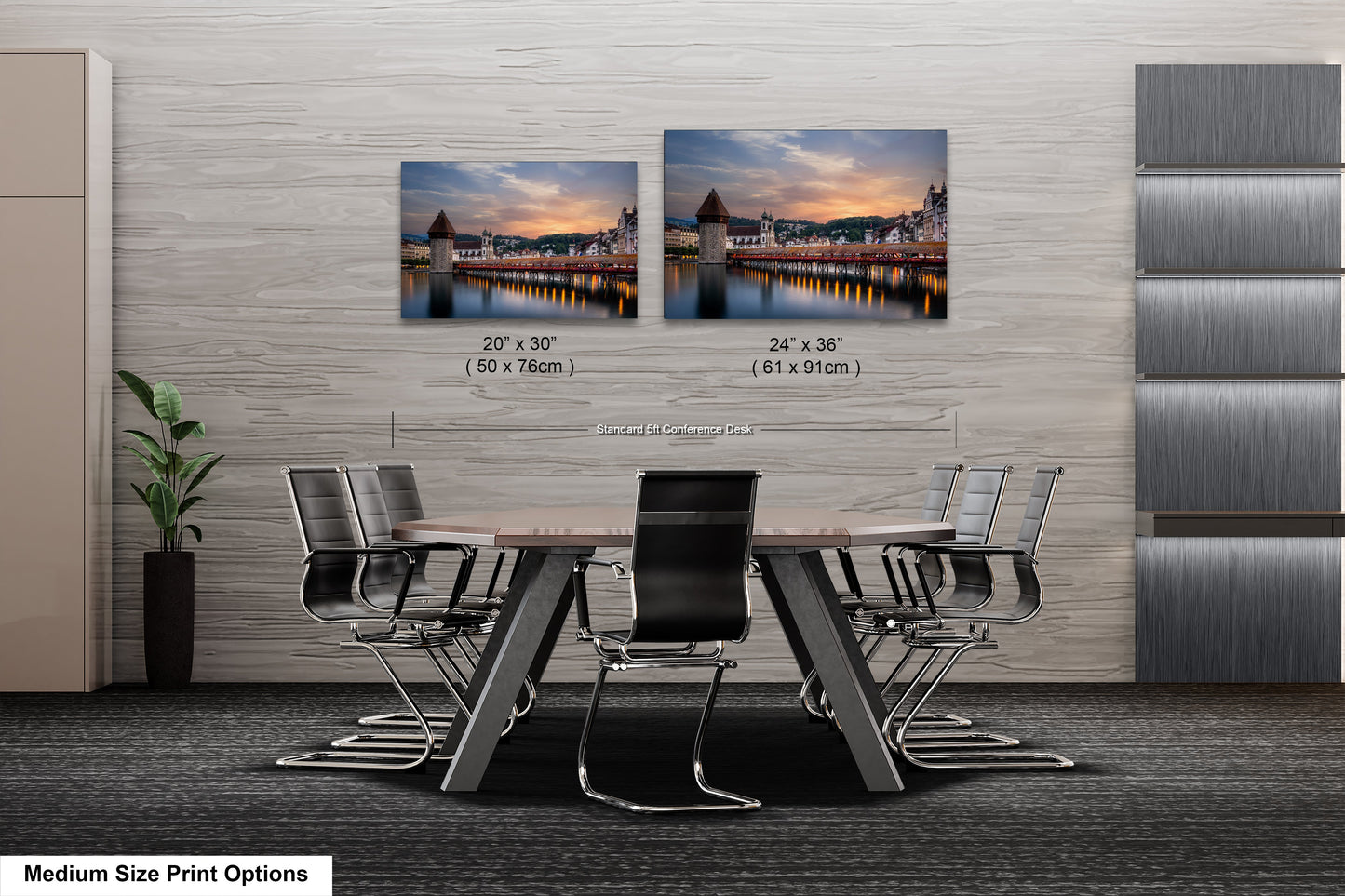 a dining room table with four chairs and two pictures on the wall