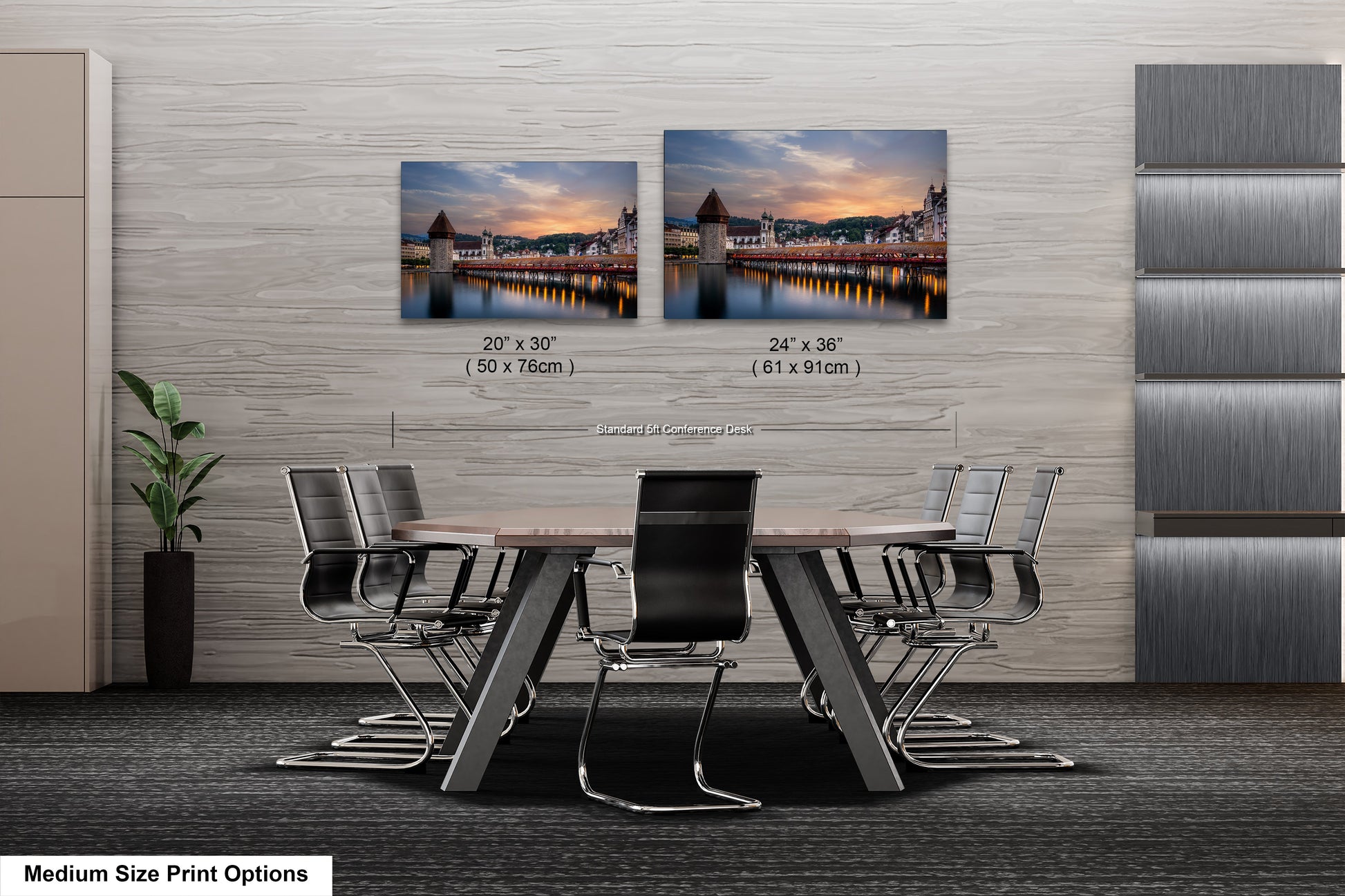 a dining room table with four chairs and two pictures on the wall