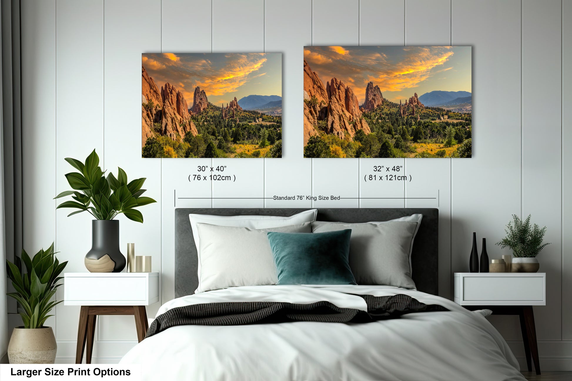 a bedroom with a bed and two pictures on the wall