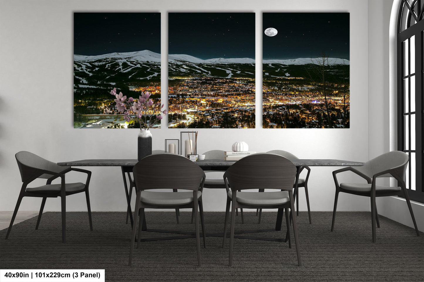 a dining room with a table and four chairs