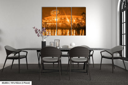 a dining room table with chairs and a painting on the wall