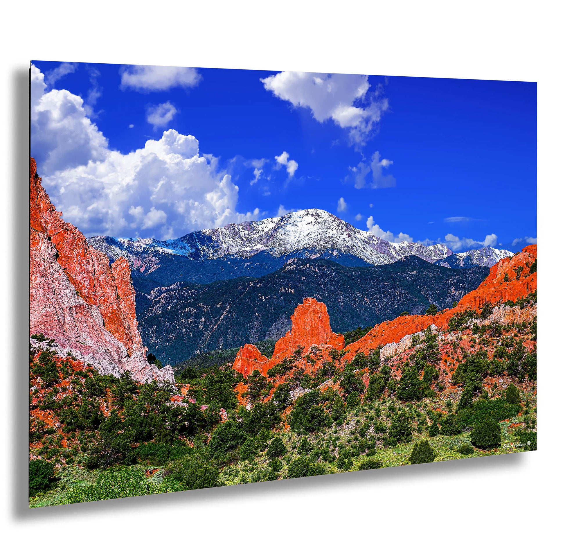 a scenic view of a mountain range in the mountains