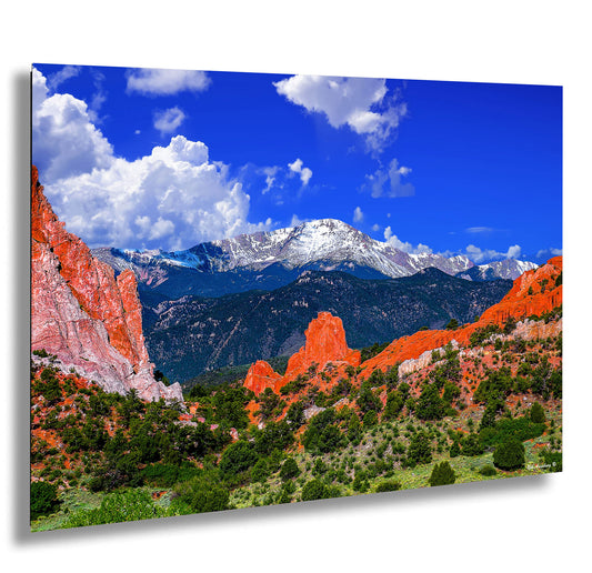 a scenic view of a mountain range in the mountains