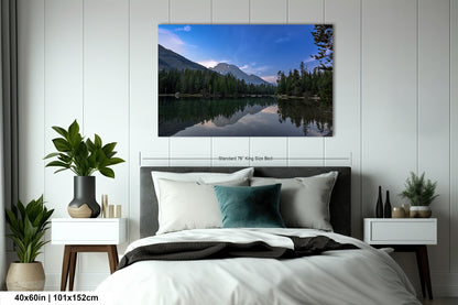 a bedroom with a large bed and a painting on the wall