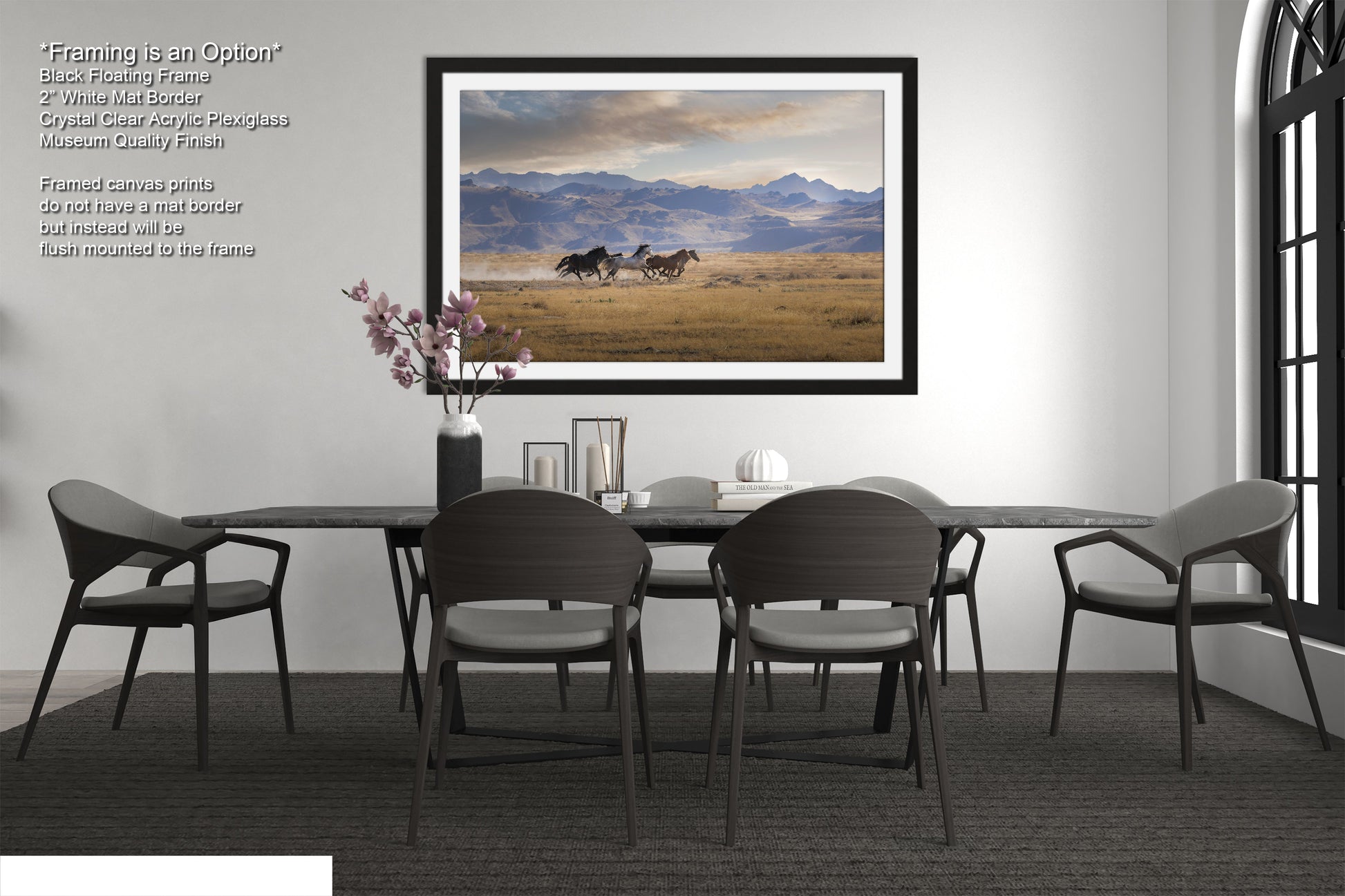 a dining room table with chairs and a picture hanging on the wall