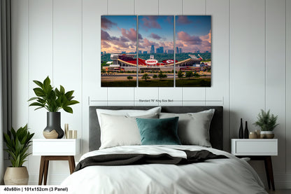 a bedroom with a large bed and a picture on the wall