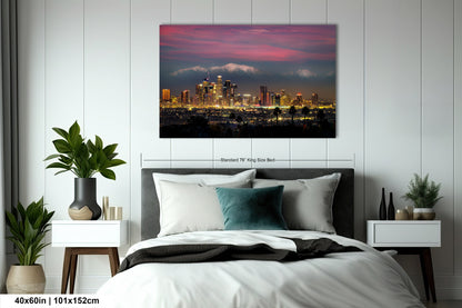 a picture of a city at night taken from a bedroom