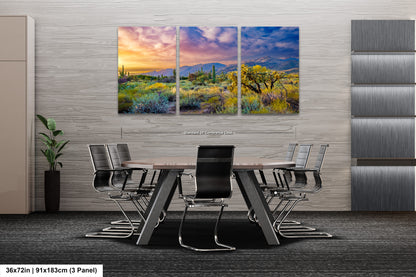 a dining room table with chairs and a painting on the wall