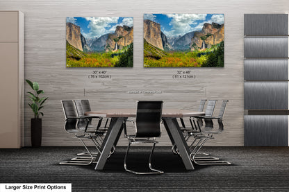 a dining room table with chairs and two pictures on the wall