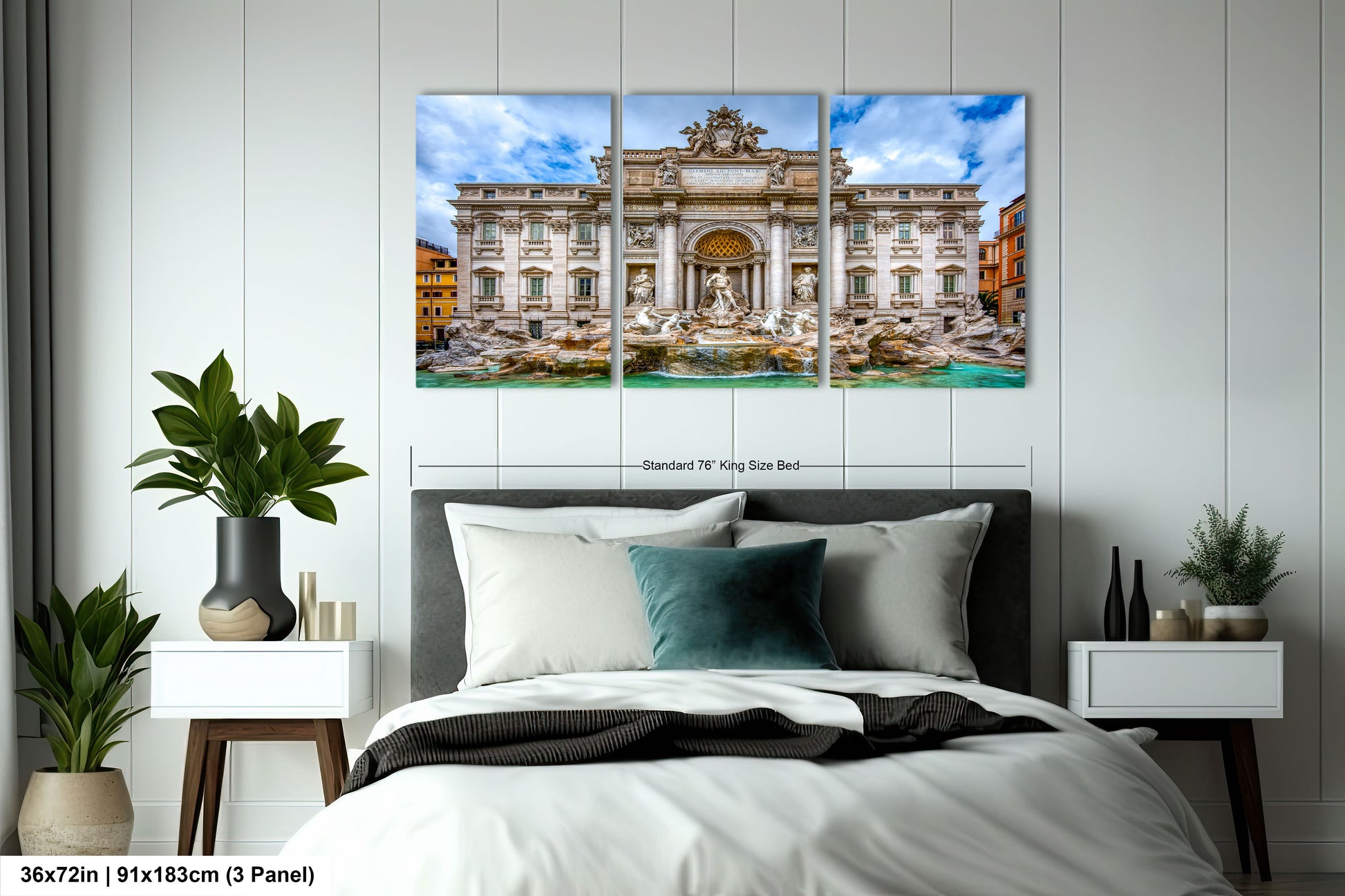 a bedroom with a bed and two paintings on the wall
