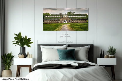 a bedroom with a large bed and a painting on the wall