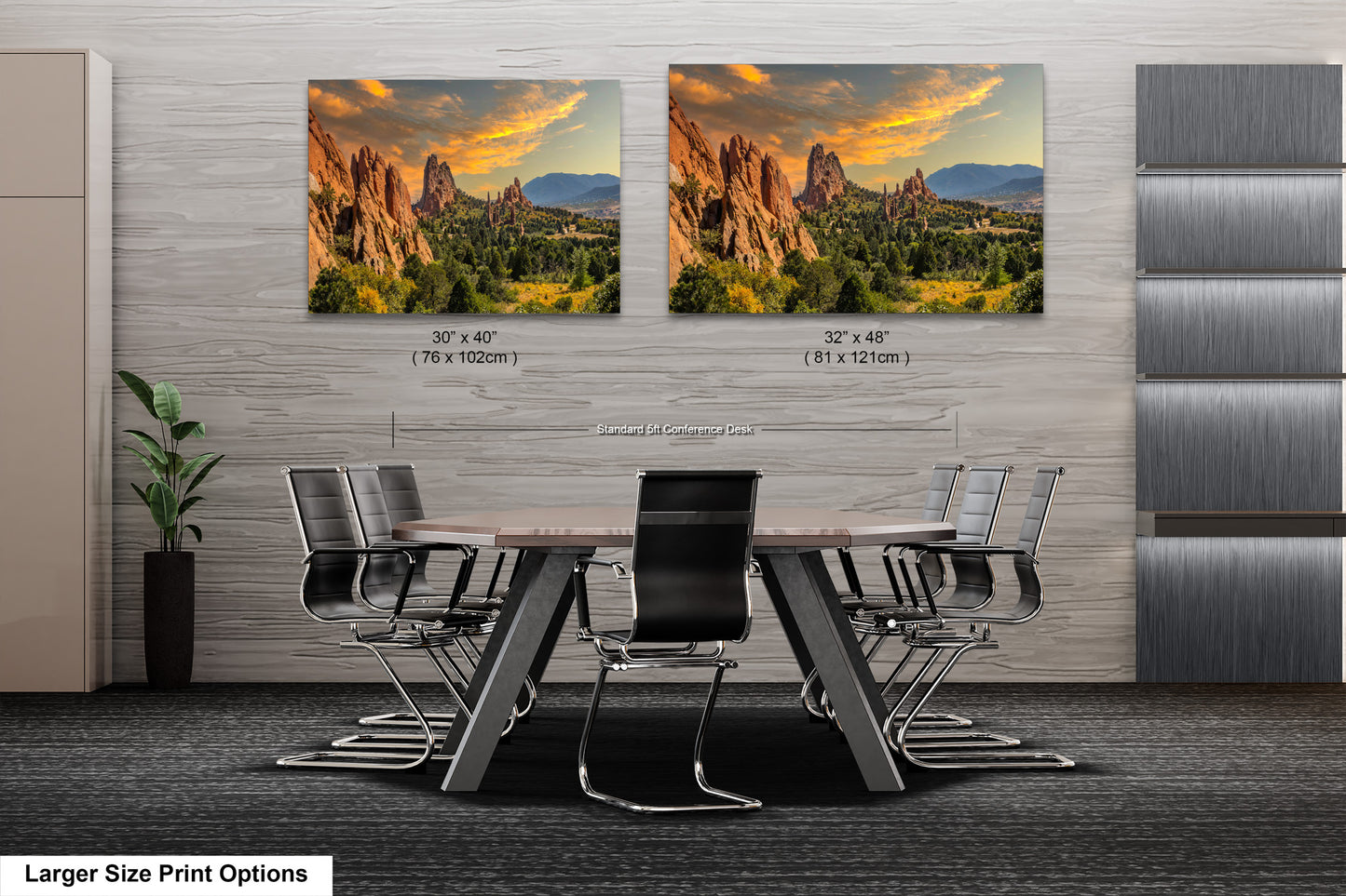 a dining room table with chairs and two pictures on the wall