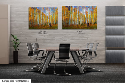 a dining room table with chairs and a painting on the wall