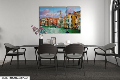 a dining room table with chairs and a painting on the wall