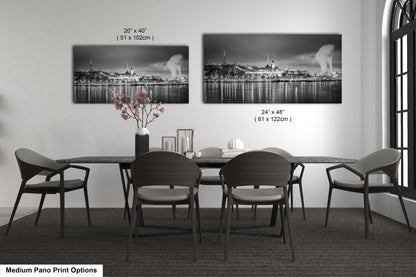 a black and white photo of a dining room table