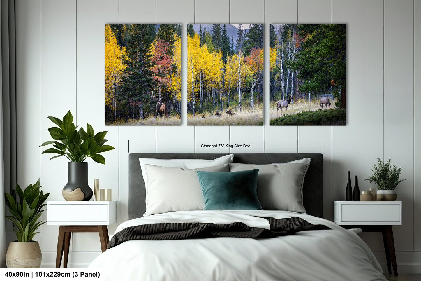 a bedroom with a bed and two paintings on the wall