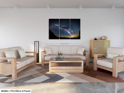 a living room filled with furniture and a painting on the wall
